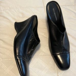 Black leather women’s heeled slides by BCBG Maxazria size 10